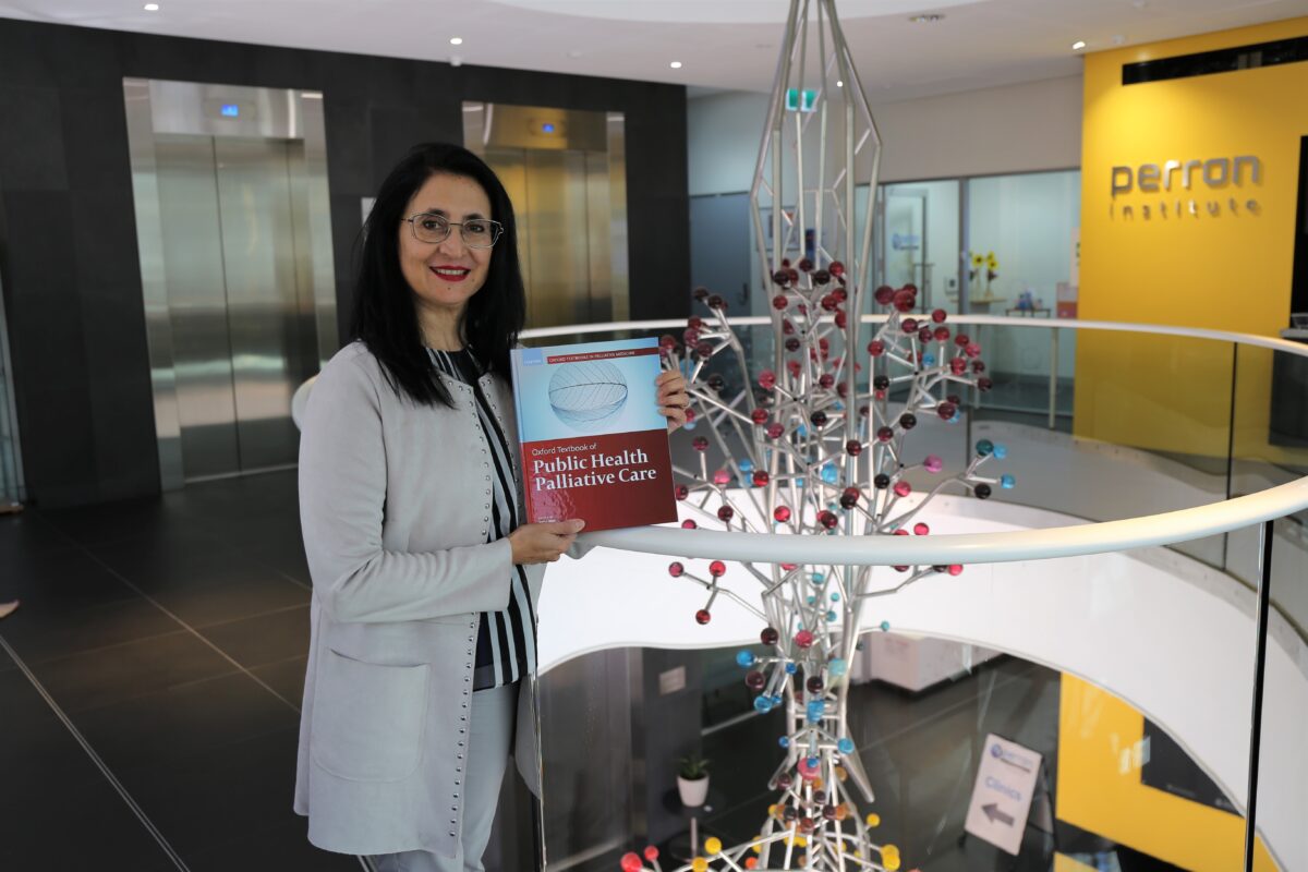 Samar Aoun with palliative care book Perron Institute