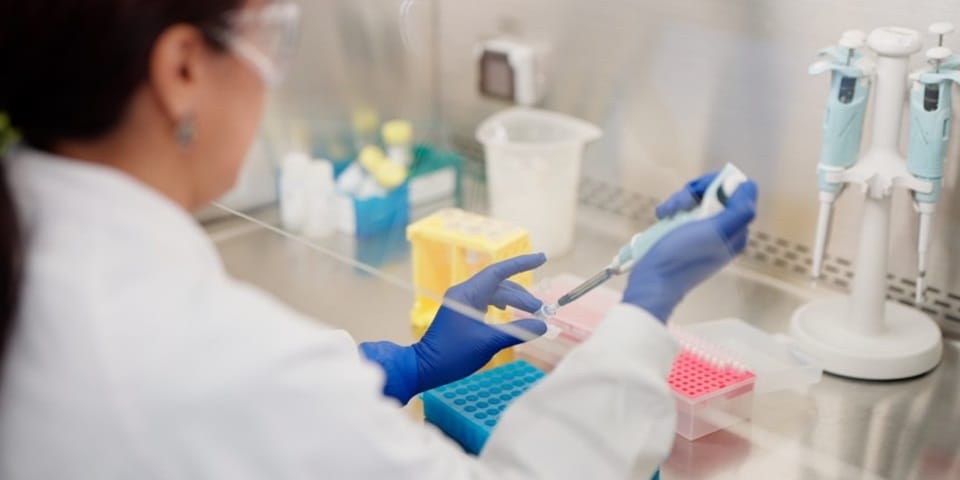 Dr May Aung-Htut working in a lab at the Personalised Medicine Centre. Image Credit Murdoch University